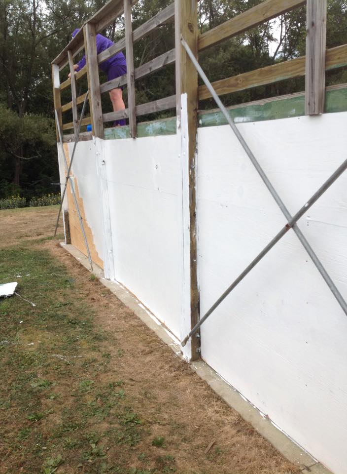 Person Works on Skate Park Ramp