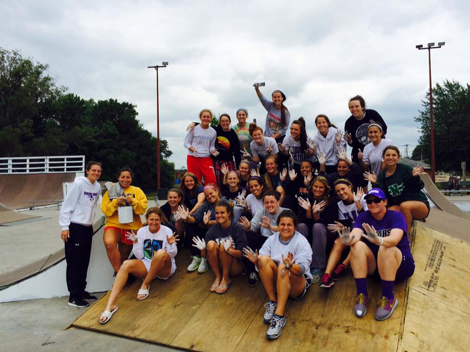 Group of Teens Sit on Ramp With Dirty Hands from Skate Park Renovation